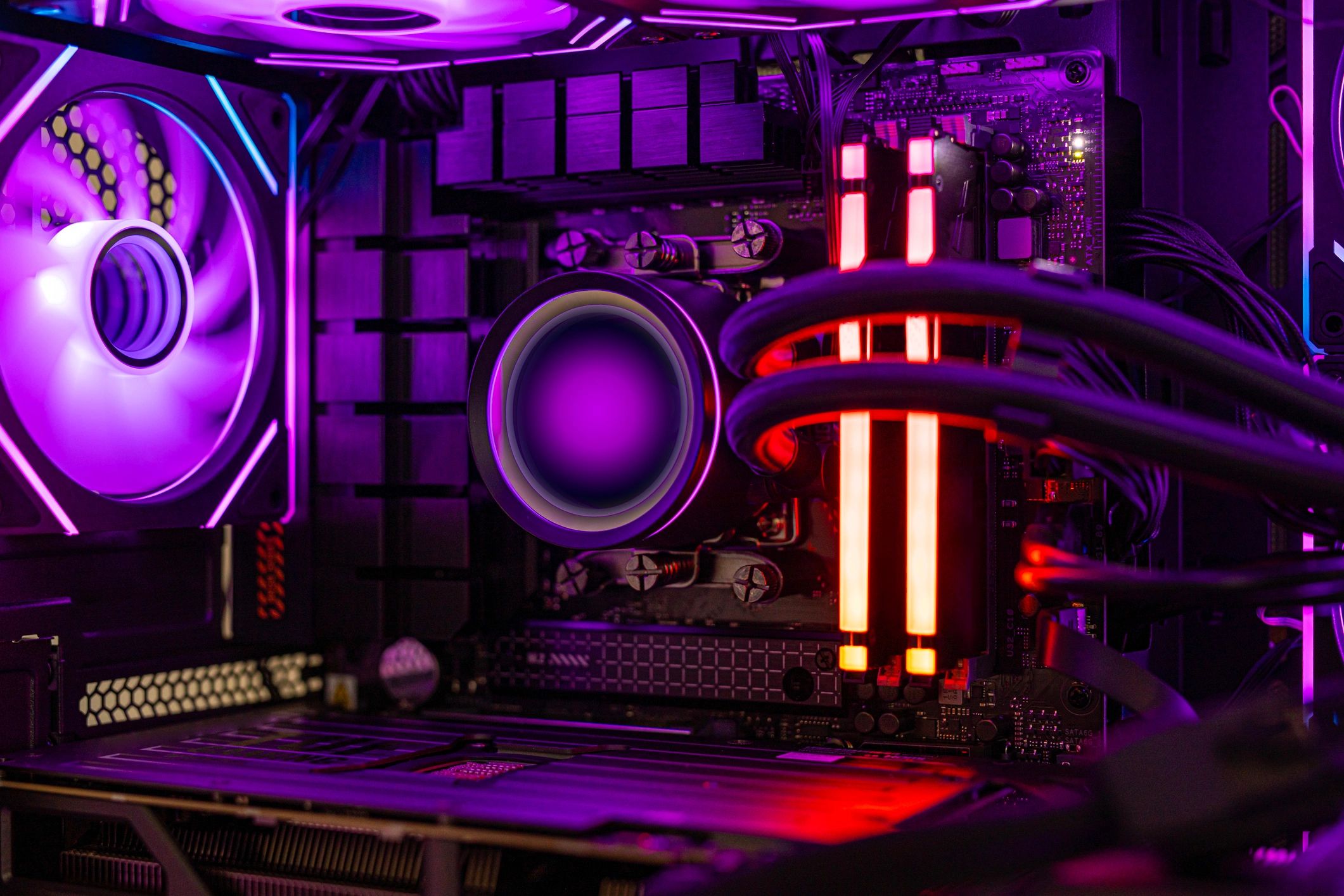 High-end RGB gaming PC interior with liquid cooling and dramatic lighting